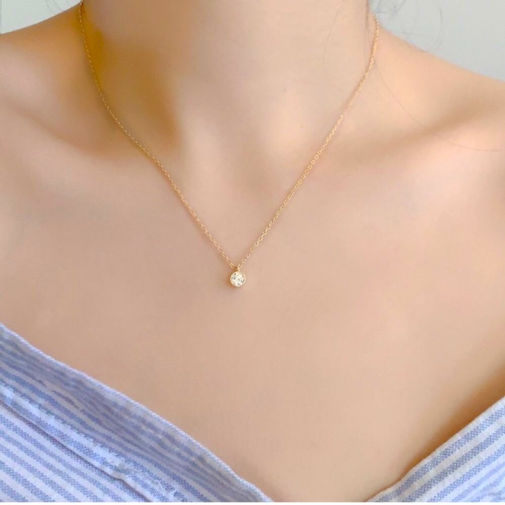 Solitaire Pendant with a Round White CZ Charm Diamond in a bezel setting.